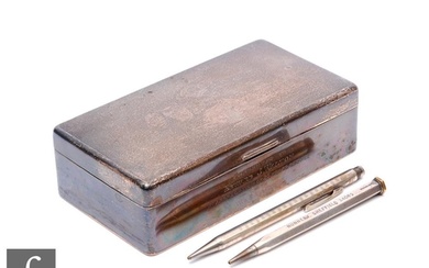 A hallmarked silver rectangular cigarette box with engine tu...