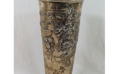 A large silver vase, of tapering cylindrical form with embos...