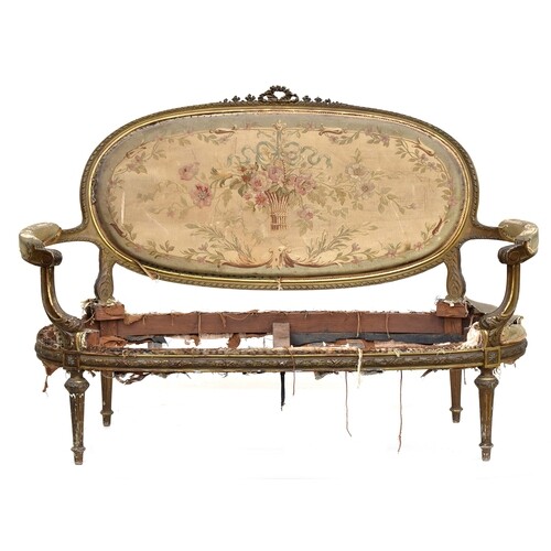 A late 19th century French giltwood open arm sofa, in need o...