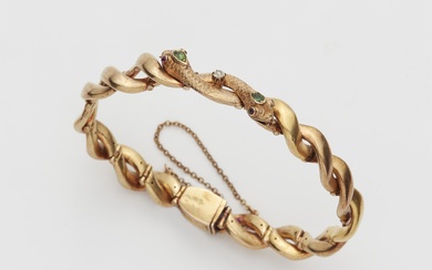 A late Victorian 18k gold peridot and ruby snake bracelet.