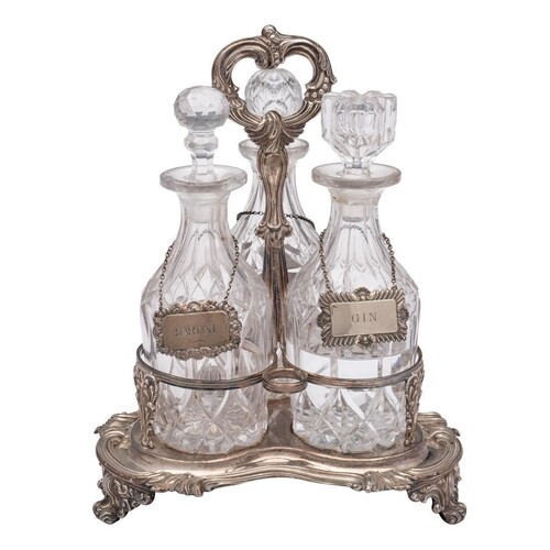 A late Victorian plated three-bottle decanter stand: of tref...