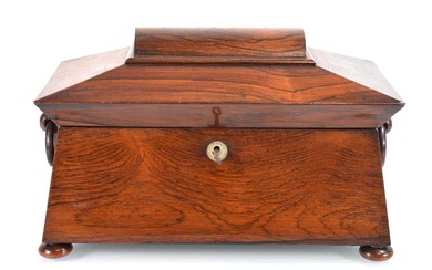 A mid-19th century rosewood tea caddy of sarcophagus form, the...