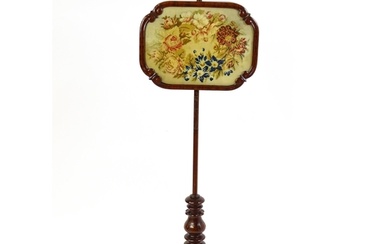 A mid 19thC mahogany pole screen, with a glazed adjustable s...