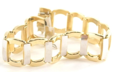 A modern bracelet, of bi colour design with outer...