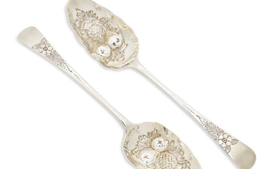 A pair of 18th century Georgian silver berry spoons, London, c.1791, maker W.S, possibly William Stephenson, the bowls designed with repousse pineapple and apple motifs, the stems engraved with floral decoration, total weight approx. 3.2oz (2)