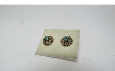 A pair of 9ct gold emerald stud earrings