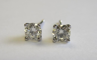 A pair of Diamond Ear Studs each claw-set brilliant-cut...