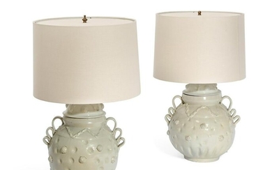 A pair of Mexican white glazed earthenware lamps