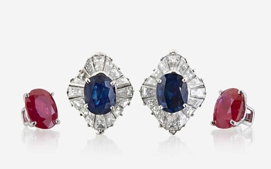 A pair of diamond and platinum earring jackets with interchangeable ruby and sapphire studs