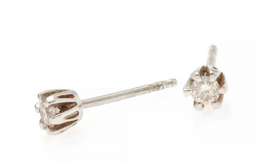 A pair of diamond ear studs each set with a brilliant-cut diamond, mounted in 14k white gold. Colour: F-G. Clarity: VS. (2)