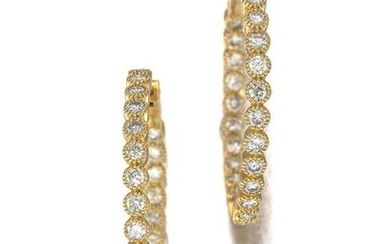 A pair of diamond hoop earrings