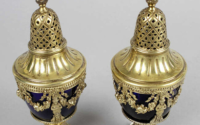 A pair of early 20th century silver-gilt casters, plus a further continental open salt and a pair of modern dwarf candlesticks.