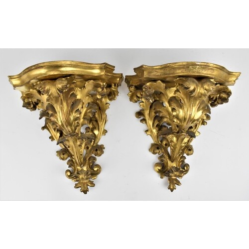 A pair of late 19th century gilt gesso wall brackets with sh...
