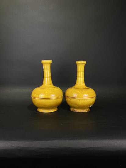 A pair of rare Chinese 19thC yellow glazed bottle-shaped porcelain vases (2). Possibly Shiwan wares.