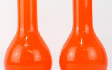 A pair of white cased and orange art glass vases...