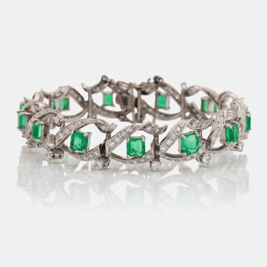 A platinum bracelet set with step-cut emeralds with a total weight of ca 12.50 cts