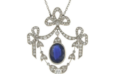 A sapphire and diamond bow pendant, with integral chain.