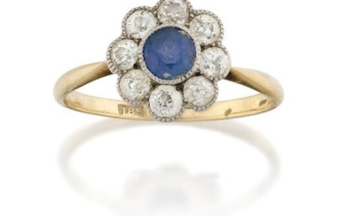 A sapphire and diamond cluster ring, the central circular cut sapphire to an old brilliant-cut diamond surround, hoop stamped 18c, ring size approx. P½