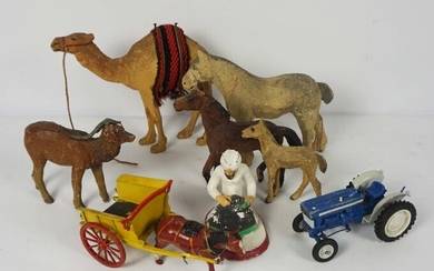 A selection of assorted carved wood animals, including a camel, with a box a various toy farm
