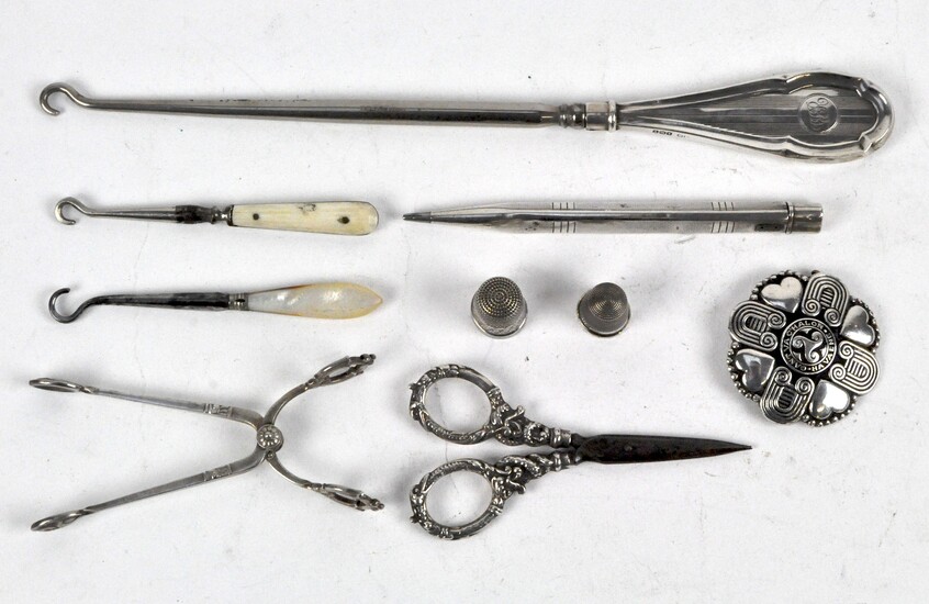 A selection of silver and silver plated wares, to include a pair of Danish silver sugar tongs