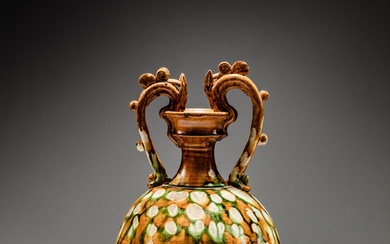 A superb sancai-glazed 'dragon'-handled amphora, Tang dynasty | 唐 三彩雙龍耳尊