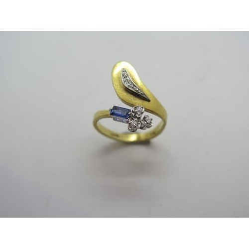 A unique 18ct diamond and sapphire ring, marked 750, No 1035...