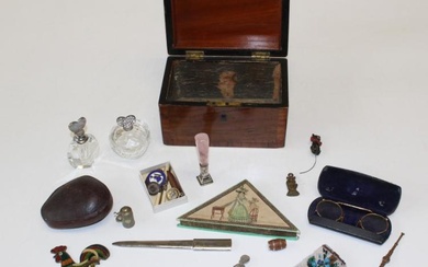 A wooden box containing a variety of collectables to include...