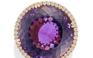 AN AMETHYST AND DIAMOND DRESS RING set with a round cut amethyst of 31.34 carats in a border of