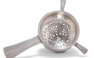 AN ARTS AND CRAFTS SILVER TEA STRAINER, by Liberty & Co