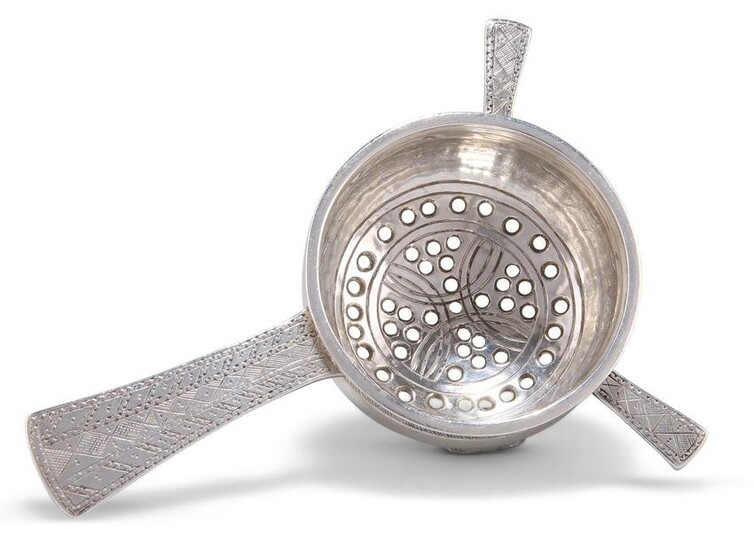 AN ARTS AND CRAFTS SILVER TEA STRAINER, by Liberty & Co
