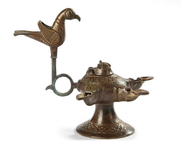 AN UMAYYAD INSCRIBED BRONZE OIL LAMP, POSSIBLY ANDALUSIA, 12TH-13TH CENTURY