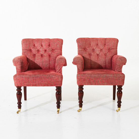 ARMCHAIRS, a pair, contemporary, front legs on wheel pulleys, armrests, seat and back upholstered in fabric.