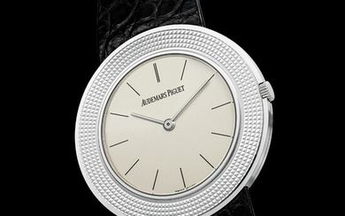 AUDEMARS PIGUET. A RARE 18K WHITE GOLD LIMITED EDITION ULTRA SLIM WRISTWATCH, MADE TO COMMEMORATE THE 50TH ANNIVERSARY OF CALIBRE 2003 REF. 14988BC, SOLD IN 1997 IN HONG KONG