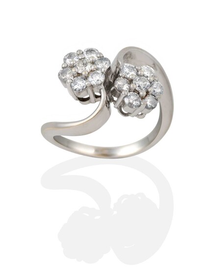 An 18 Carat White Gold Diamond Double Cluster Twist Ring