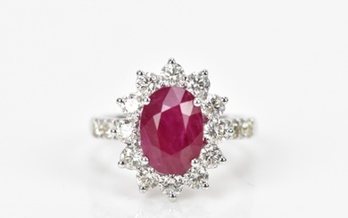 An 18ct white gold, diamond and ruby dress ring, set with ce...