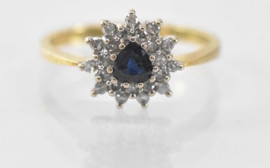 An 18ct yellow gold sapphire and diamond set cluster ring,...