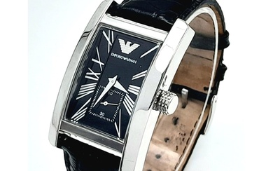 An Armani Designer Quartz Gents Watch. Black leather strap. ...