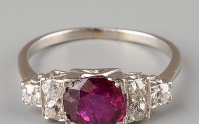 An Art Deco style ruby and diamond ring, set with a round-cu...