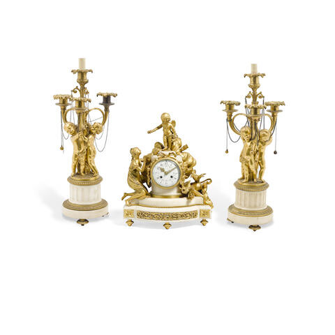 An Assembled Louis XVI style gilt bronze and marble three piece clock garniture