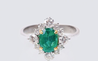 An Emerald Diamond Ring.