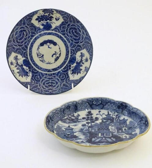 An Oriental blue and white plate with stylised peony