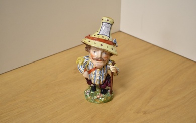 An early 19th century Derby porcelain mansion house dwarf, modelled dressed in opulent attire