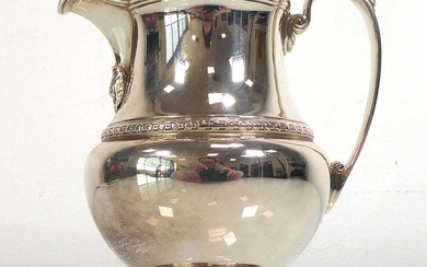 An early 20th century silver milk jug decorated in the...