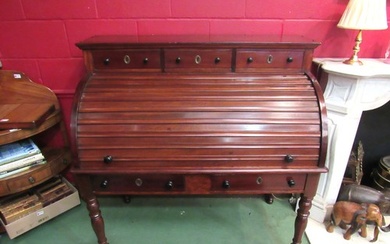 An early Victorian mahogany roll top desk, the three raised ...