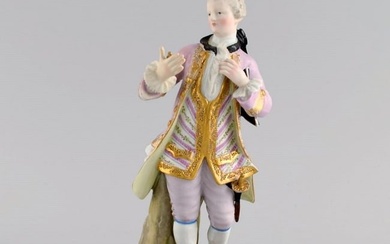 Antique Meissen porcelain figure. Noble gentleman with gold watch. Late 19th century.