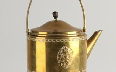Antique brass tea pot on a stove.&#160 Germany, WMF