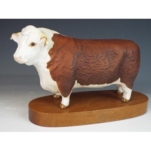 Beswick Hereford bull standing on an oval wooden plinth . 5 ...