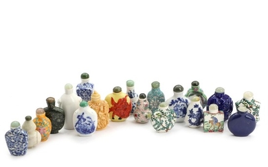 Chinese porcelain snuff bottles, including one blanc de chine, nephrite and resin, primarily with nephrite lids. Mostly 20th century. H. 5–9 cm. (20)