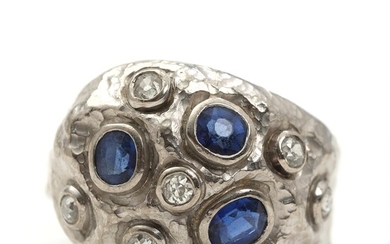 SOLD. Diamond and sapphire ring set with numerous old-mine cut diamonds and faceted sapphires mounted...