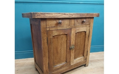 Early 20th C. oak and pine cupboard with two long doors over...